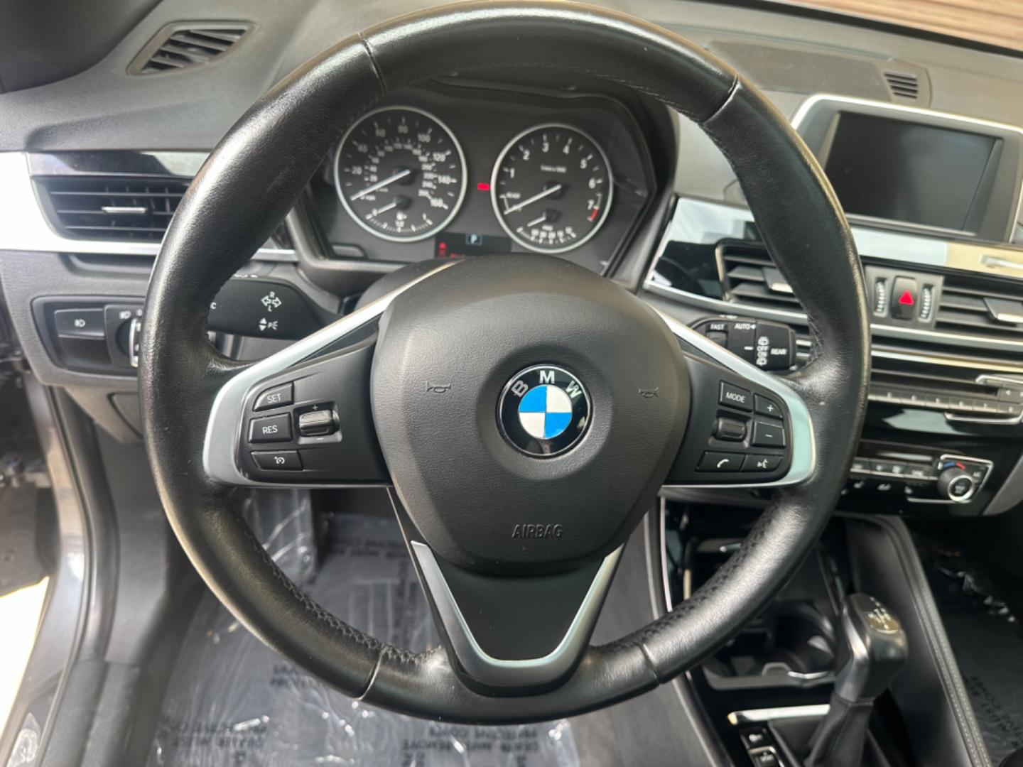 2016 Gray /Black BMW X1 leather (WBXHT3Z34G4) with an 4 CYLINDER engine, Automatic transmission, located at 30 S. Berkeley Avenue, Pasadena, CA, 91107, (626) 248-7567, 34.145447, -118.109398 - Crown City Motors is a used “Buy Here Pay Here” car dealer in Pasadena CA. “Buy Here Pay Here” financing, means that when you purchase your vehicle from our dealership, that you make the payments to the dealership as well. We do not need the banks approval to get you approved for a used auto - Photo#25